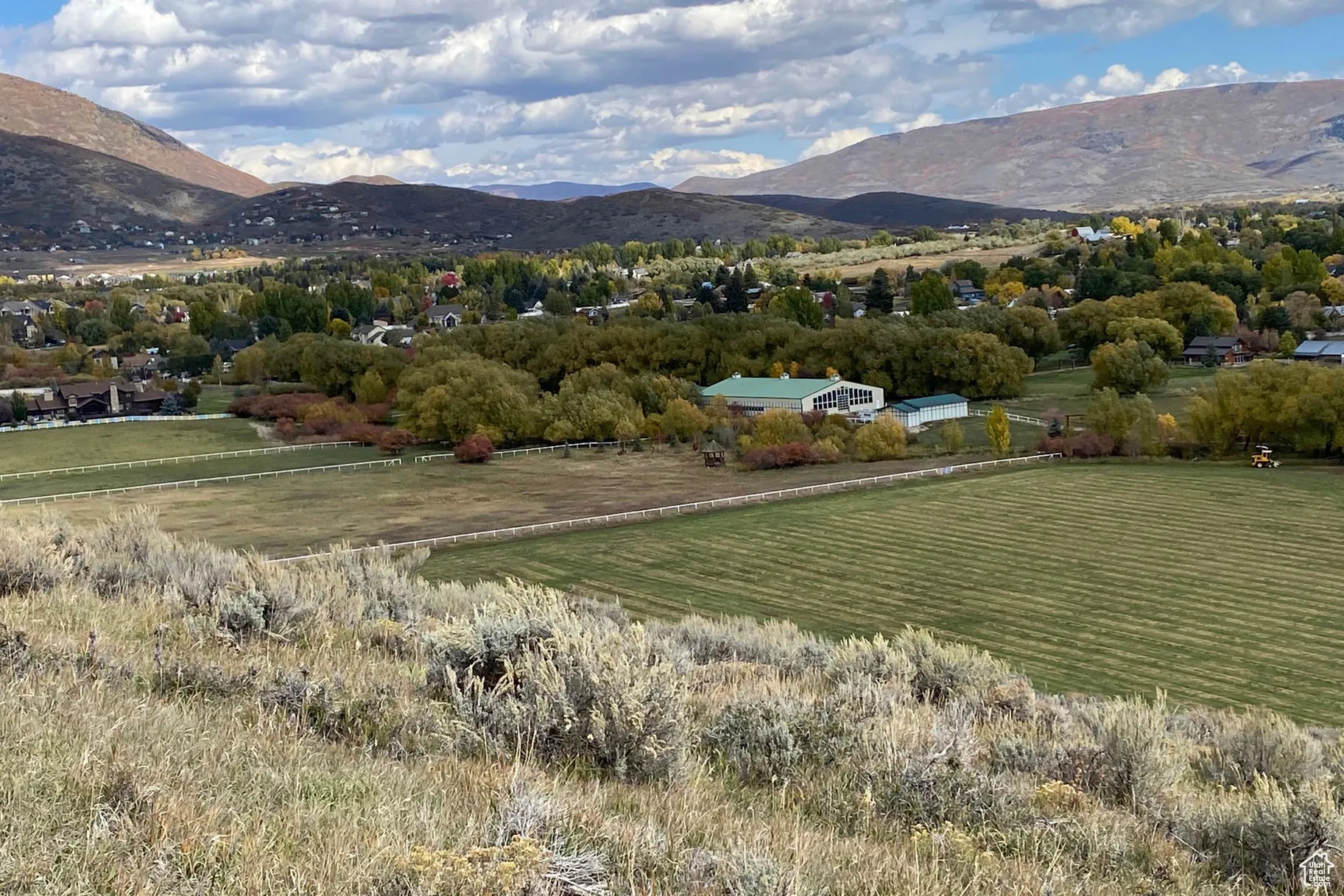 View of mountain backdrop featuring rural landscape