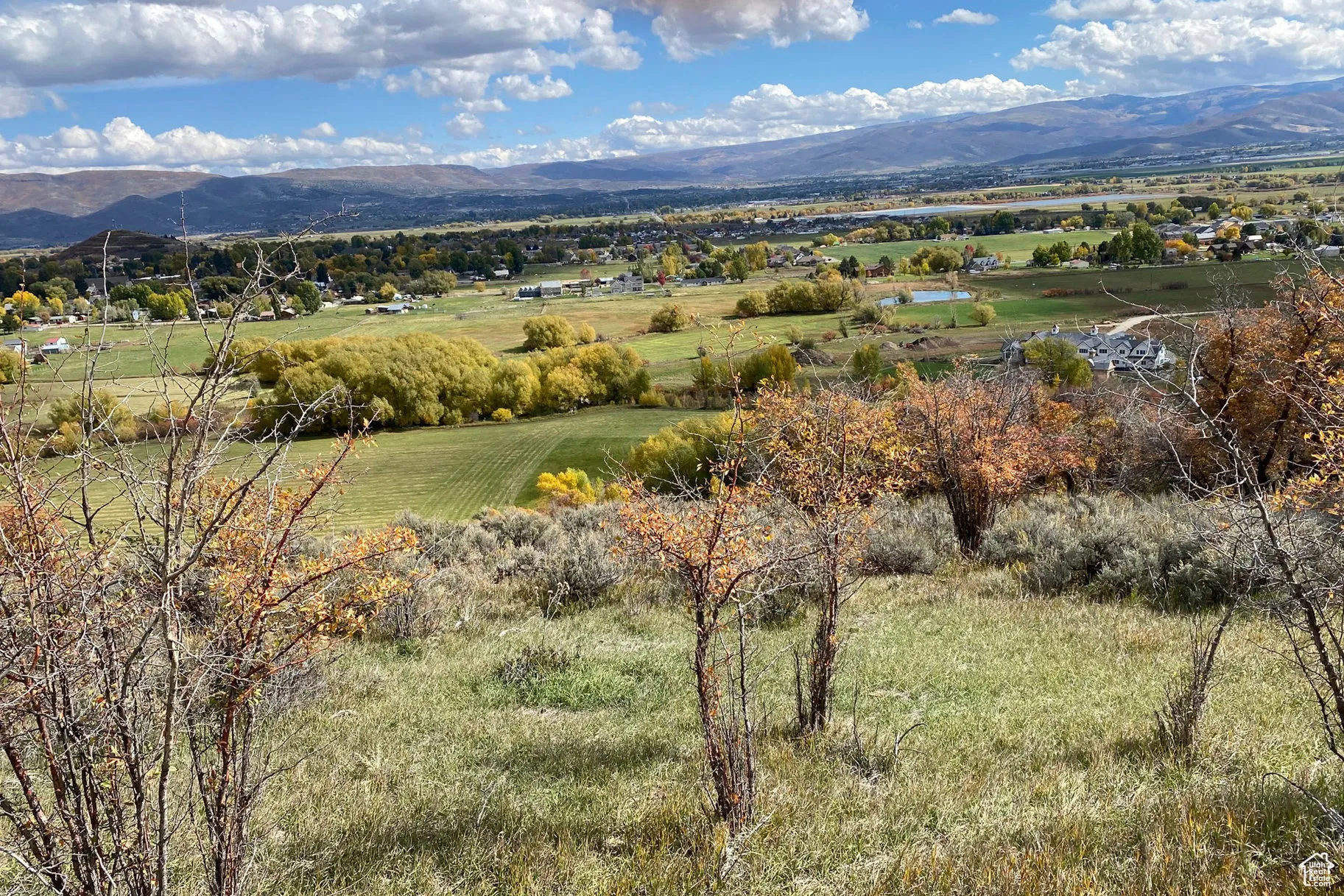 View of mountain background featuring rural landscape