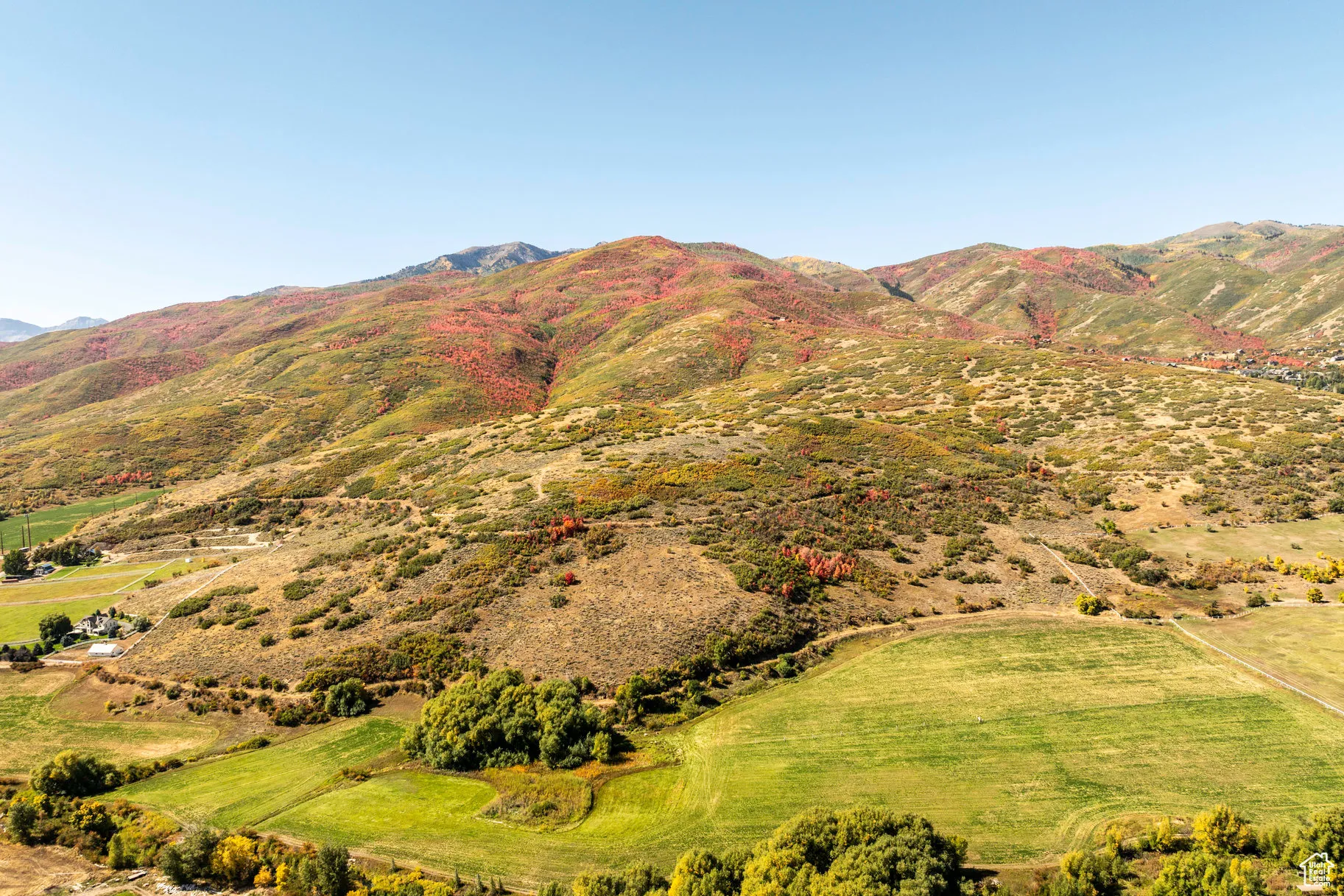 View of mountain backdrop featuring rural landscape