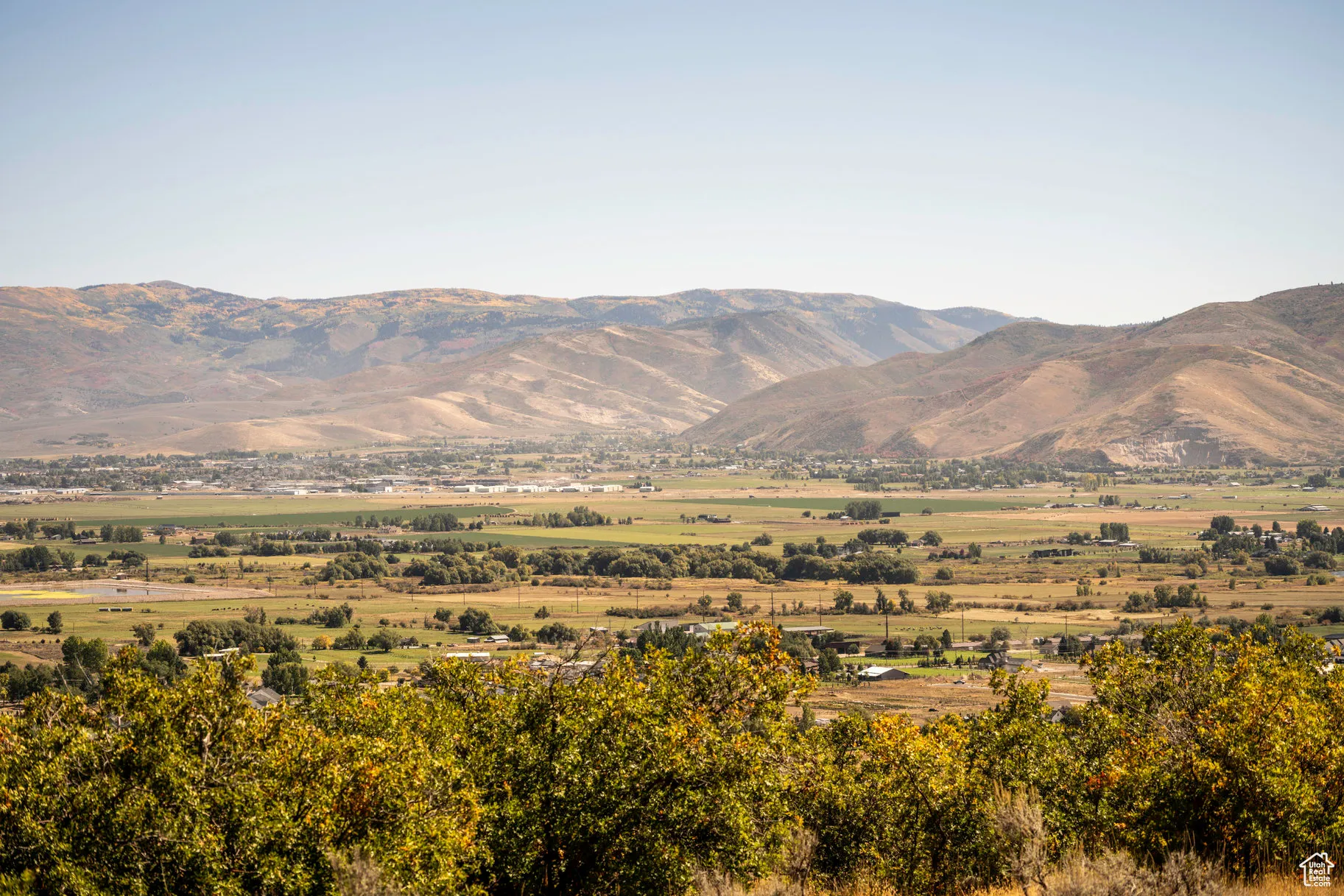 View of mountain backdrop featuring rural landscape