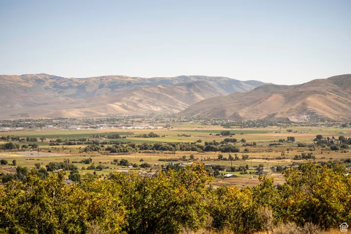 View of mountain backdrop featuring rural landscape