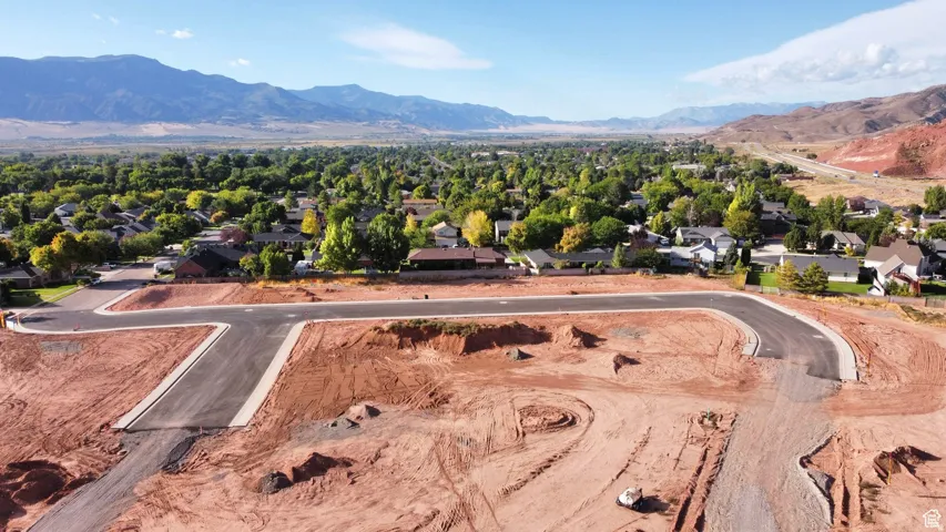 Aerial view of residential area featuring mountains