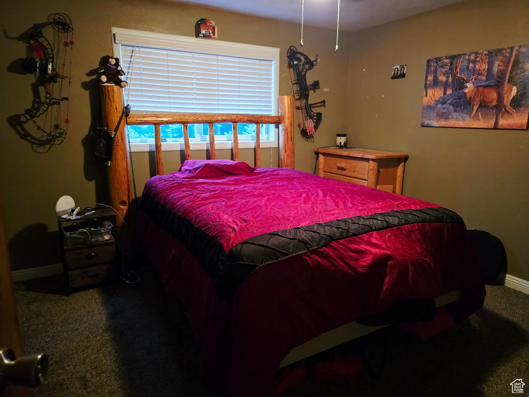 Carpeted bedroom with baseboards