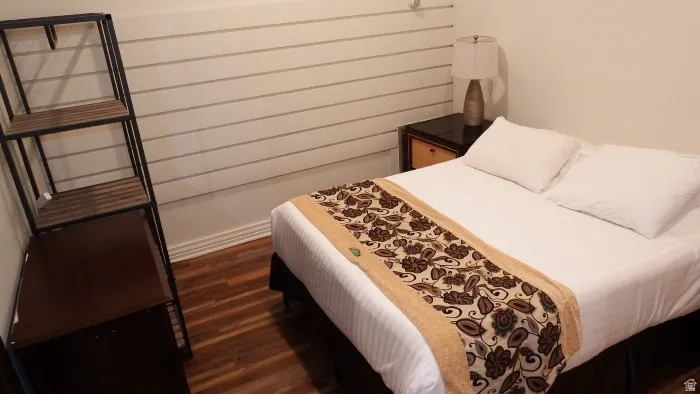 Bedroom featuring dark wood-style floors