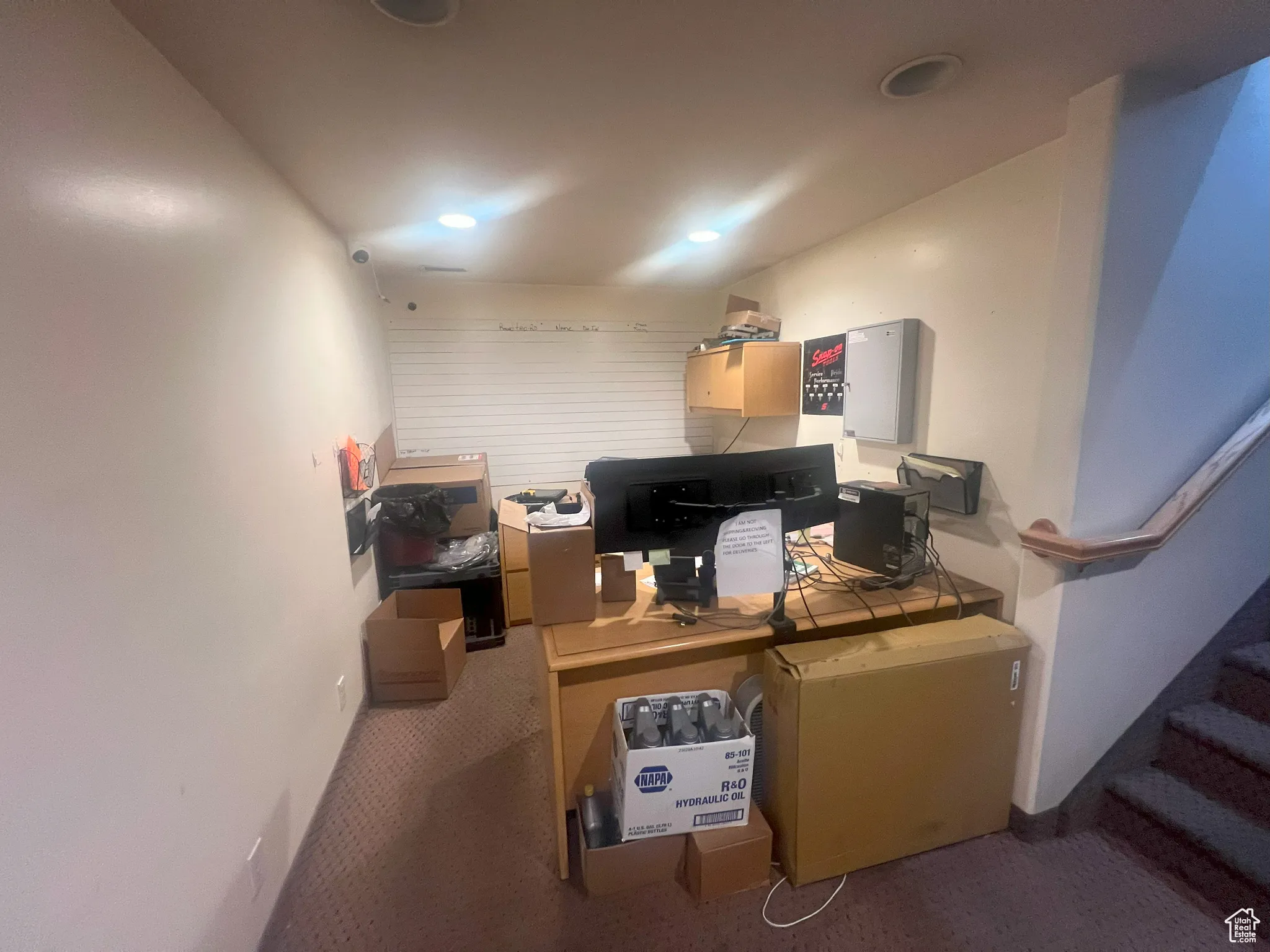 Below grade area with carpet flooring, an office area, and recessed lighting