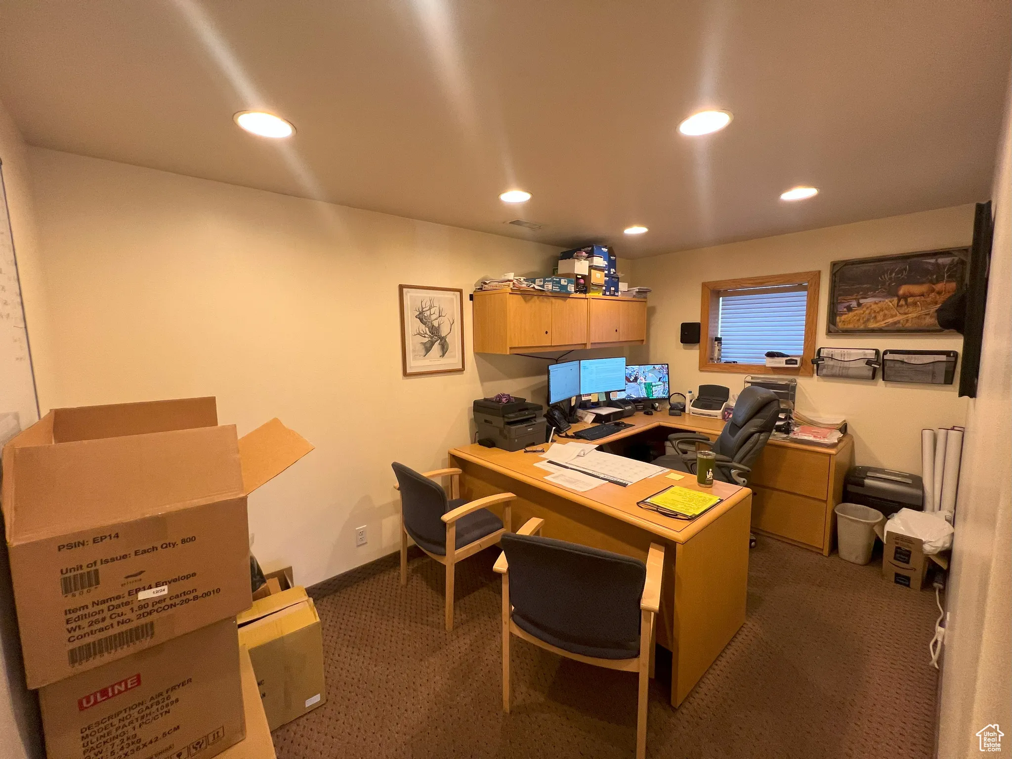 Home office featuring recessed lighting and dark colored carpet