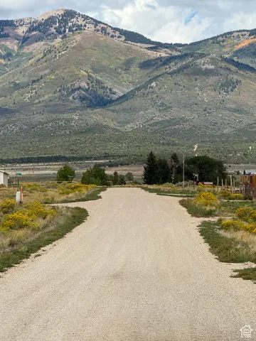 Street view.  Mountain view featuring rural landscape.