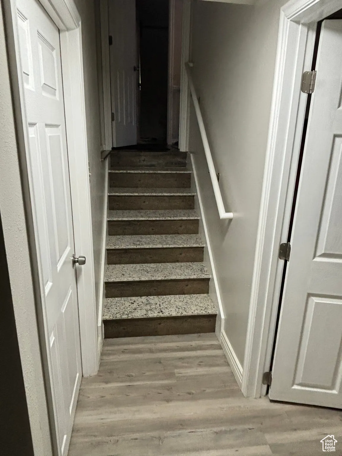 Staircase with wood finished floors