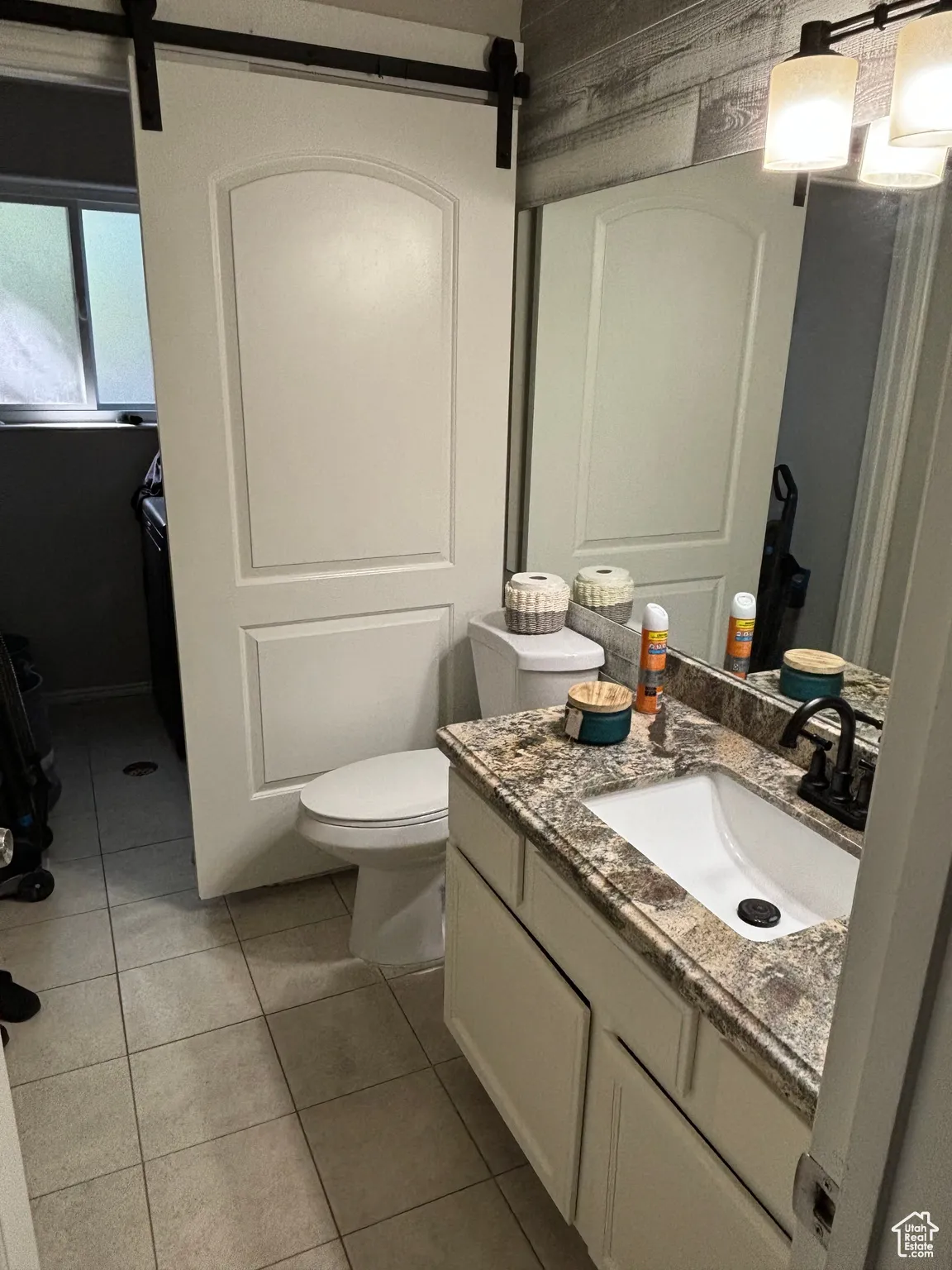 Bathroom with vanity and light tile patterned floors