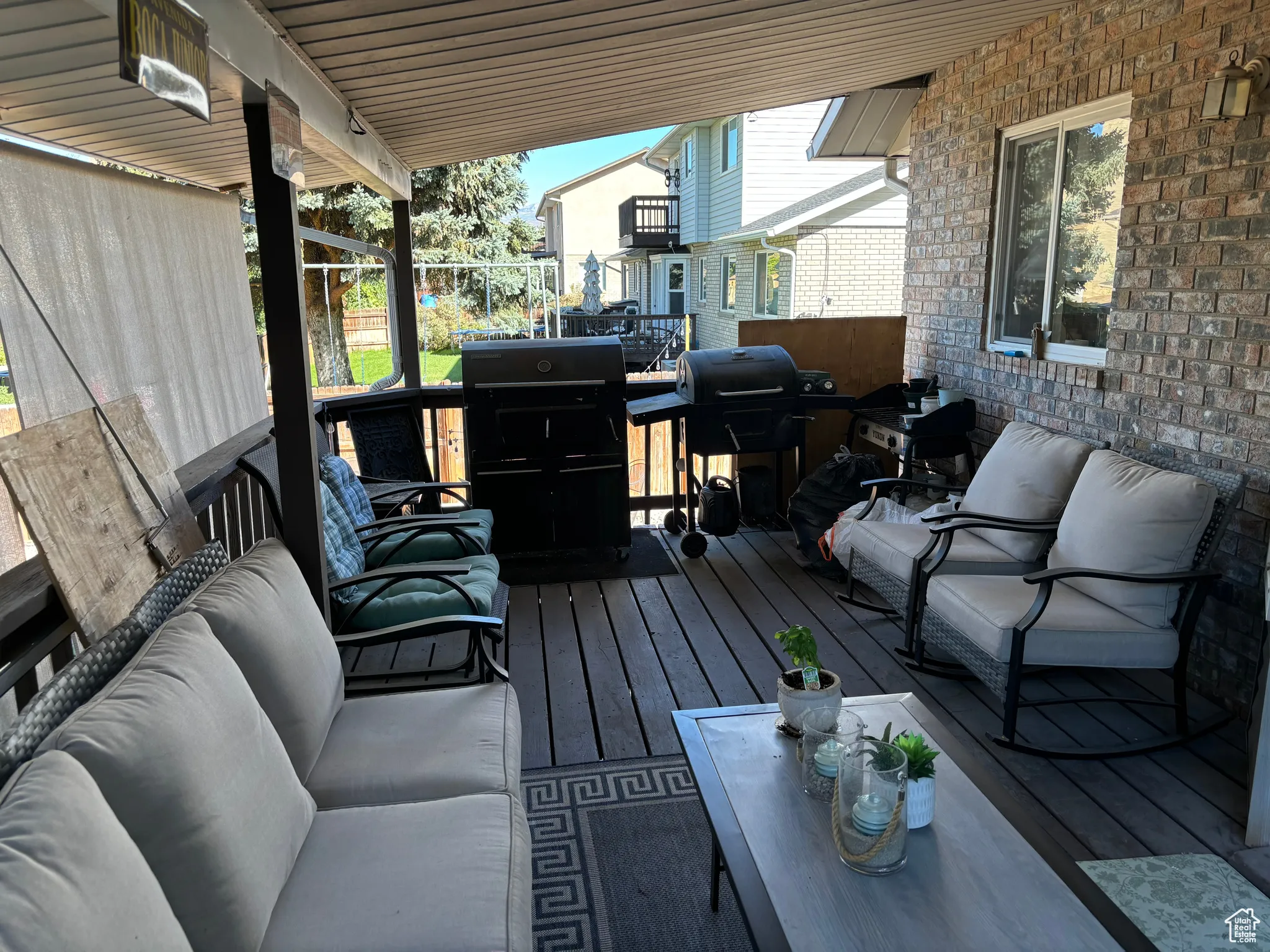 Deck featuring outdoor lounge area and grilling area