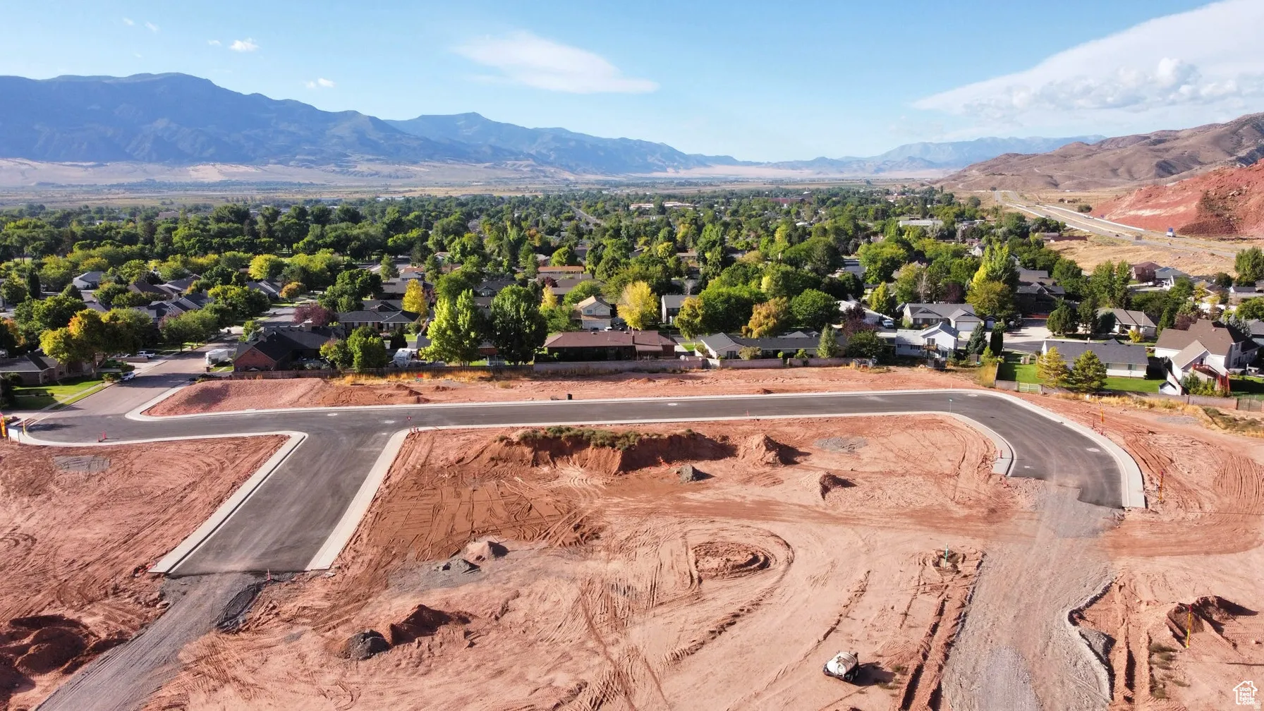 Aerial view of residential area featuring mountains