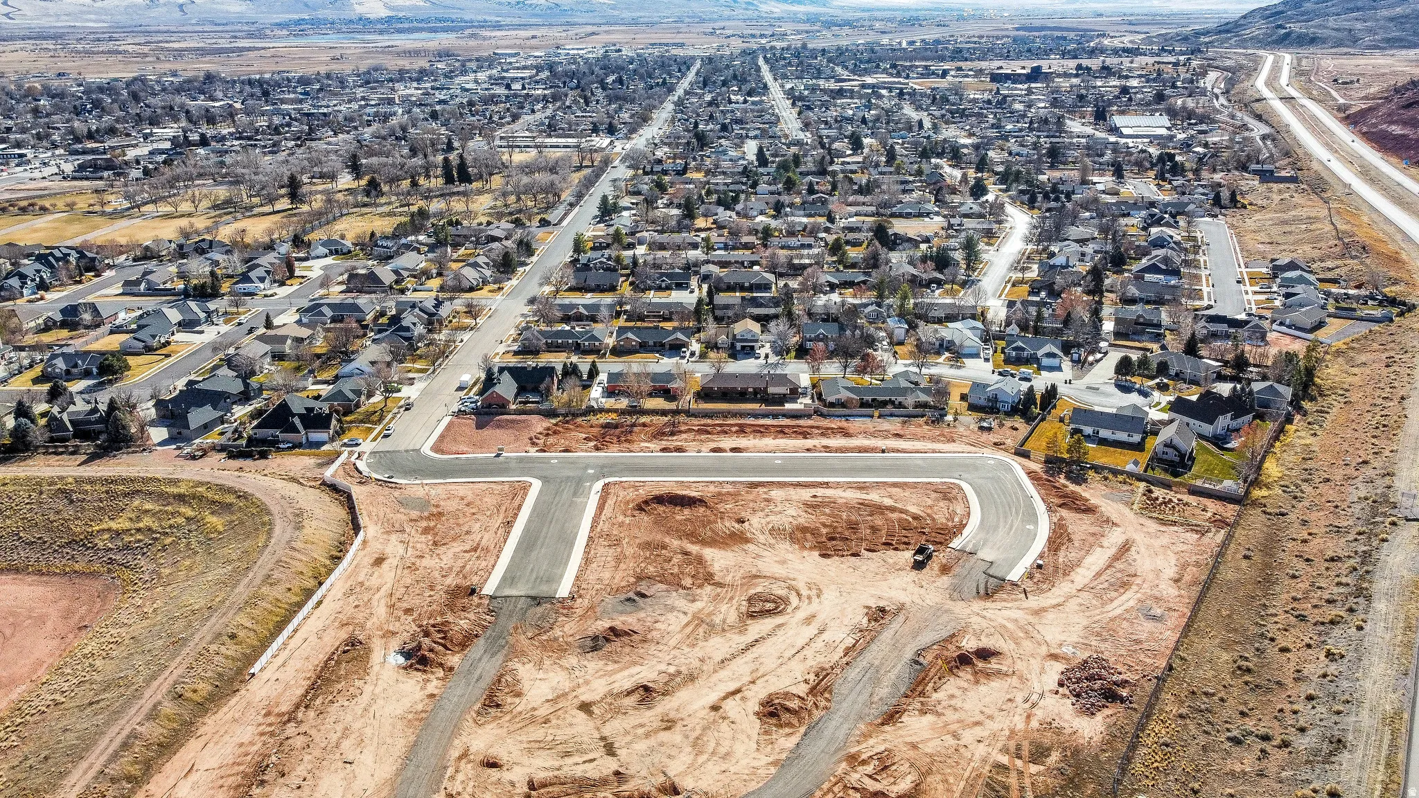 Aerial overview of property's location featuring nearby suburban area