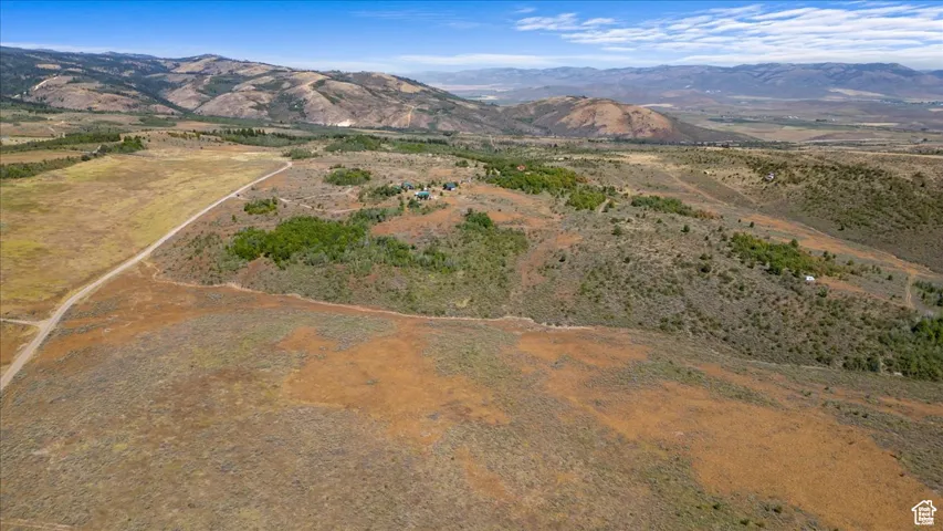 View of property location with a mountainous background and rural landscape