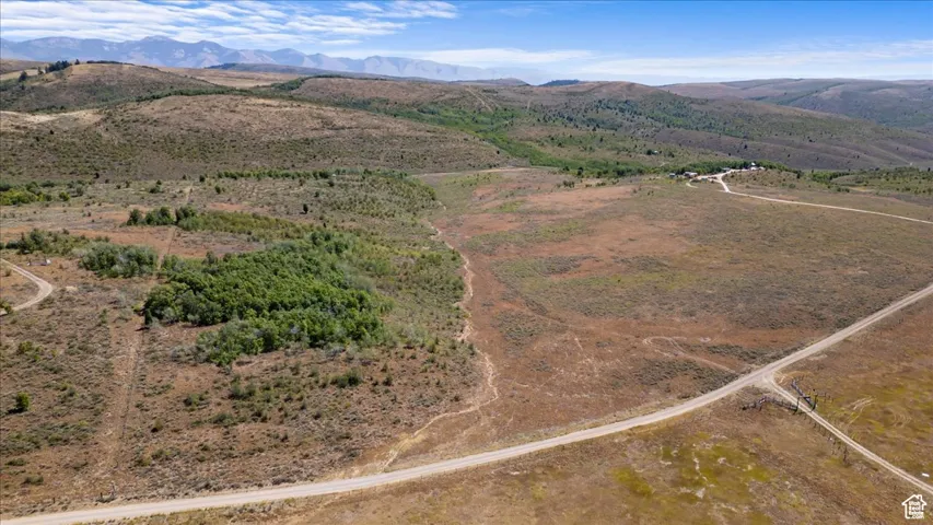 Aerial view of property and surrounding area featuring rural landscape