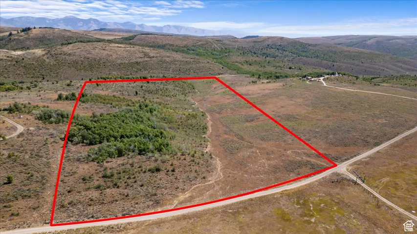 Aerial view of sparsely populated area with property boundaries highlighted