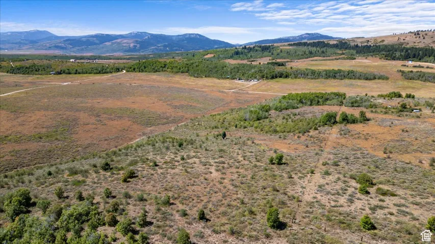 View of mountain background featuring rural landscape