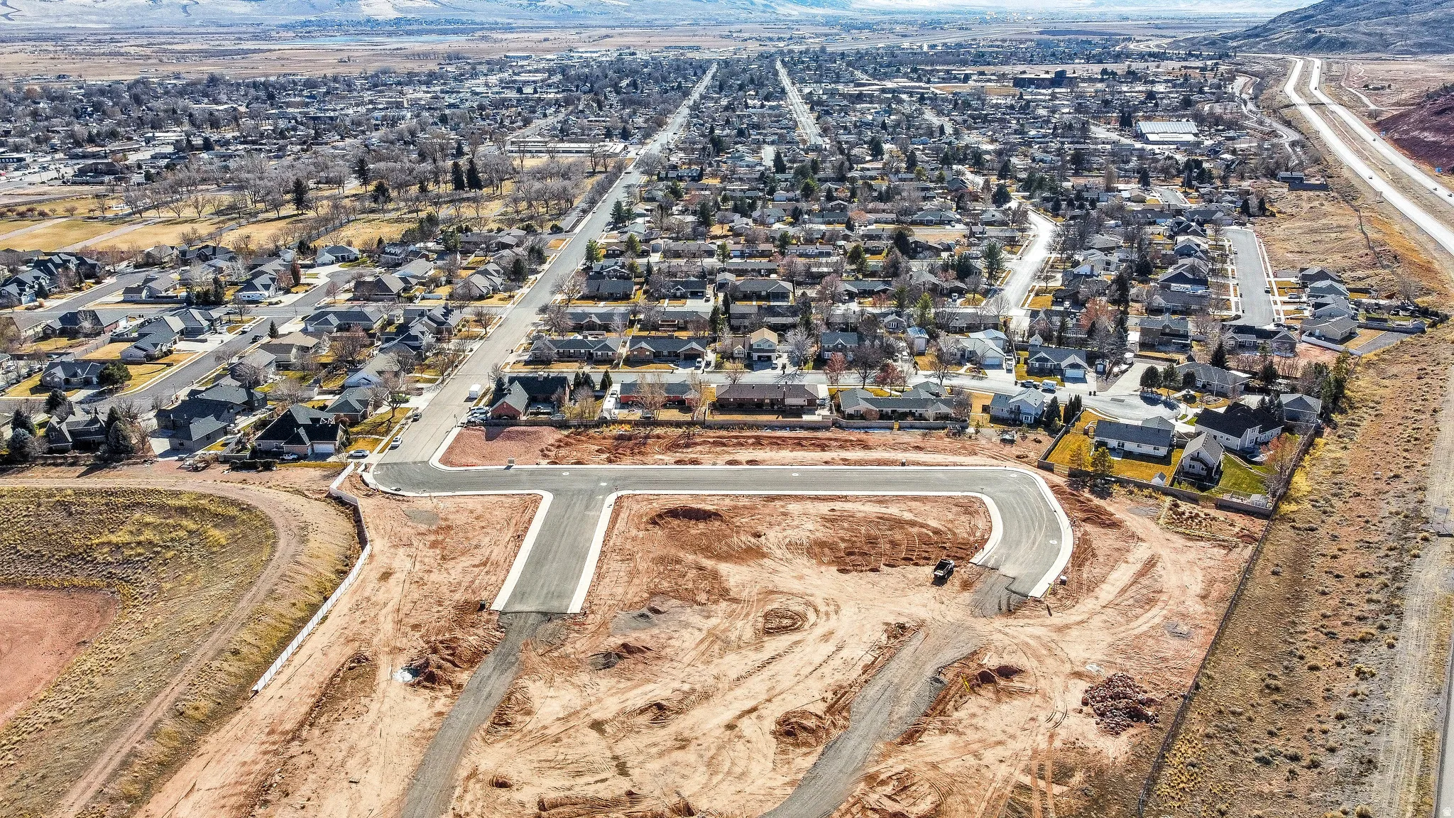 Aerial overview of property's location featuring nearby suburban area