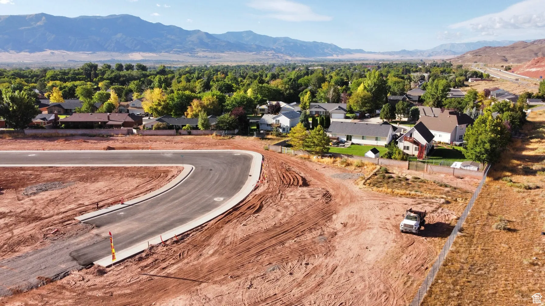 Aerial view of residential area featuring a mountainous background