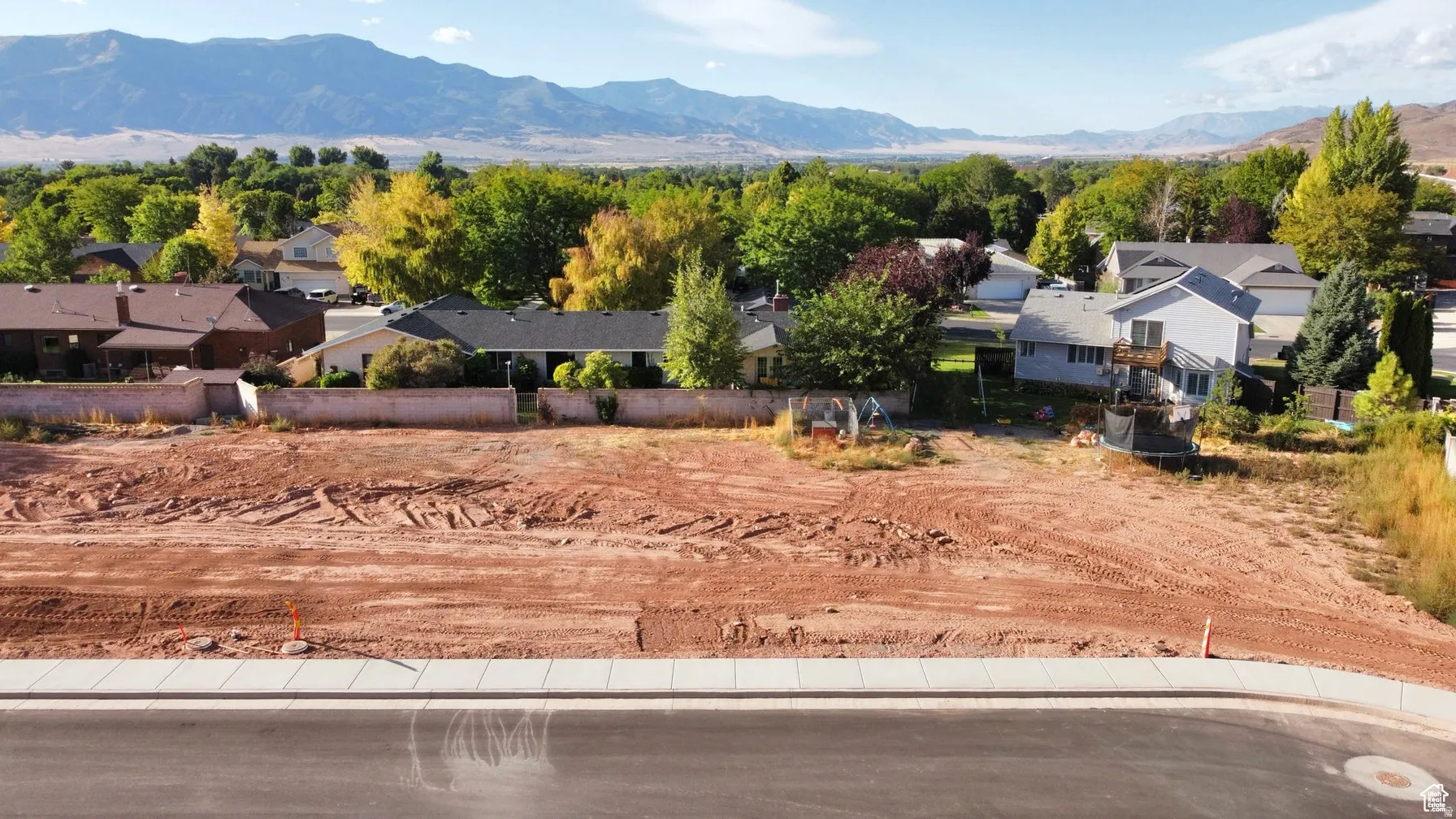 View of mountain background featuring nearby suburban area