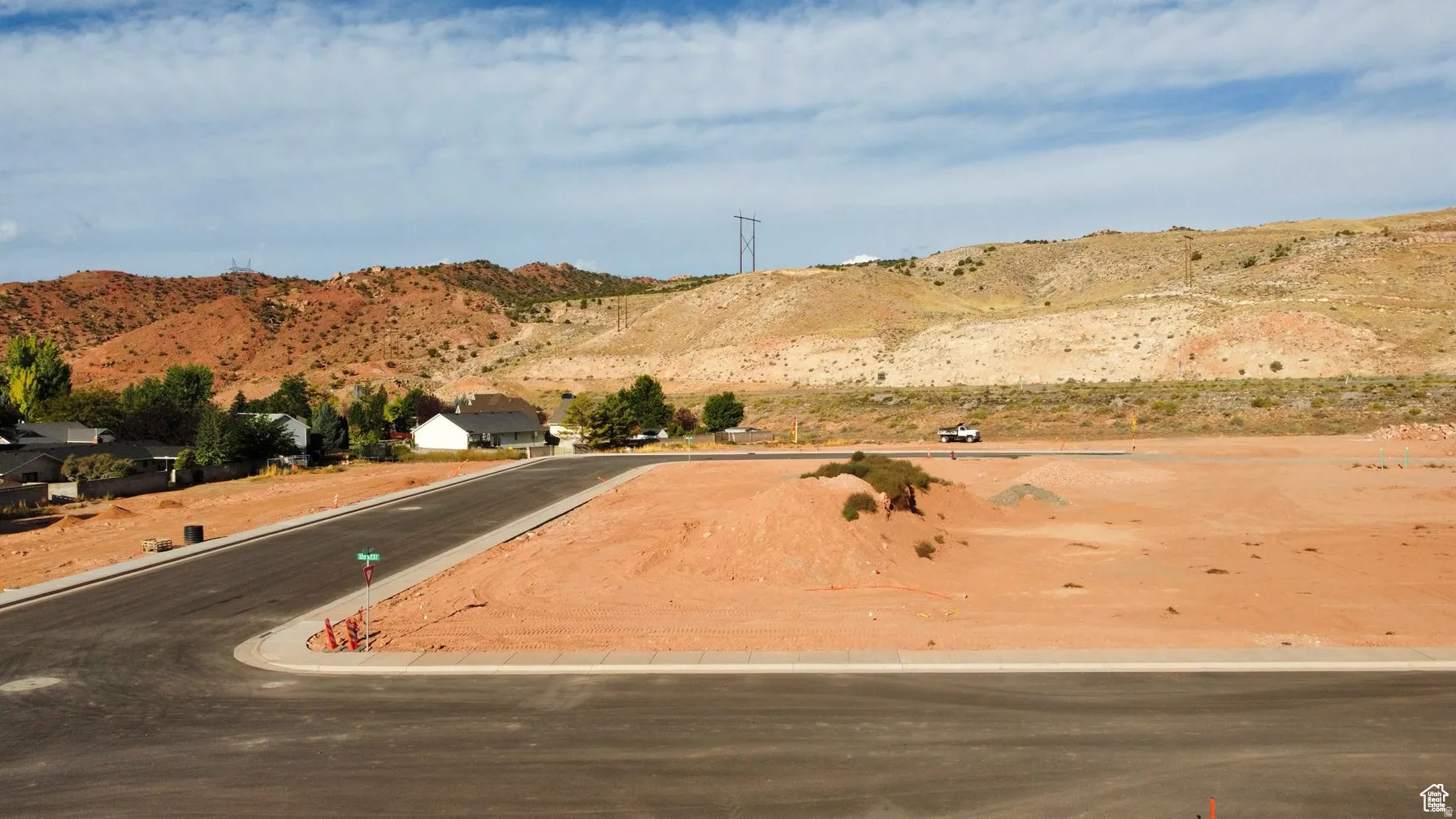 View of asphalt road with a mountain view and curbs