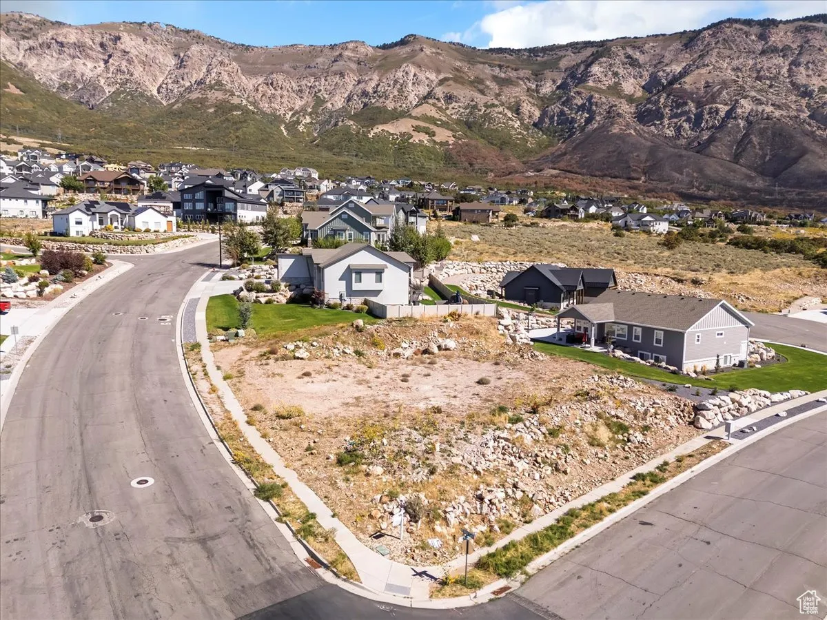 Aerial perspective of suburban area with a mountainous background
