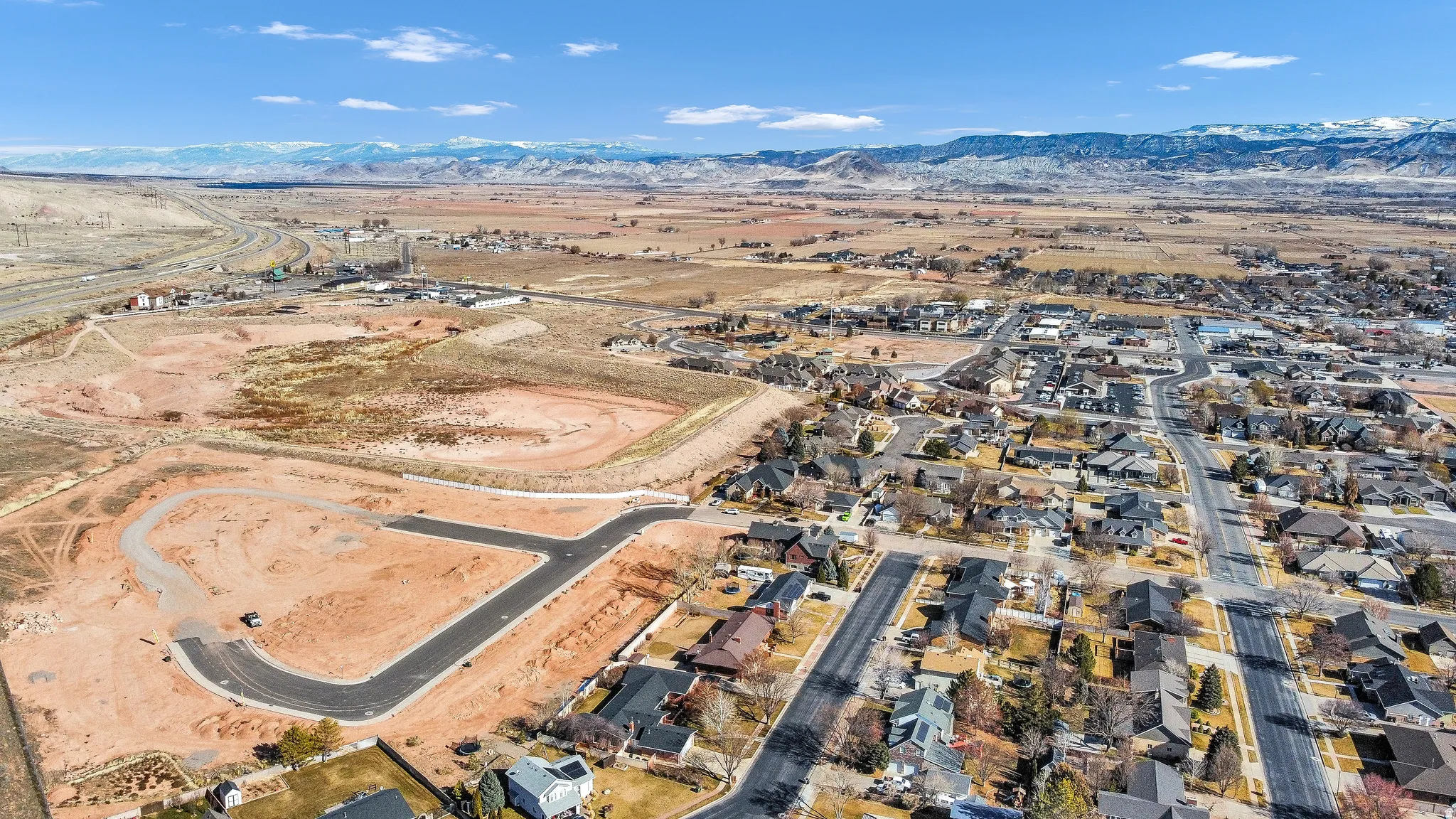Aerial perspective of suburban area with mountains