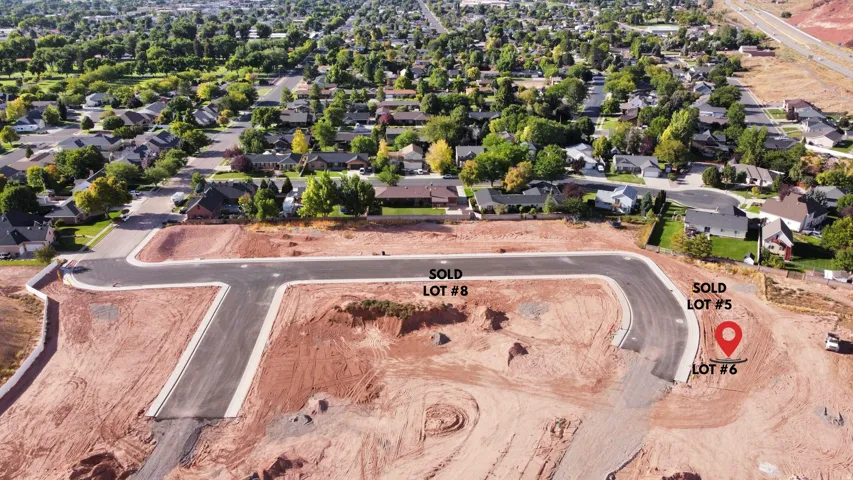 Aerial view of residential area with property boundaries highlighted