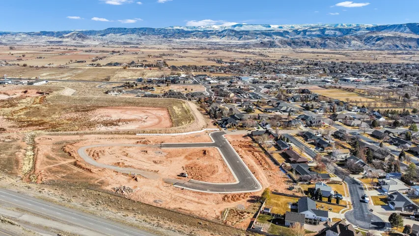 View of property location with a mountainous background and nearby suburban area