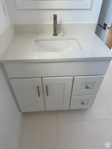 Bathroom with vanity and light tile patterned floors