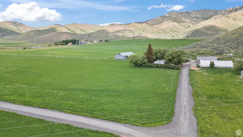View of mountain backdrop with rural landscape and a pastoral area