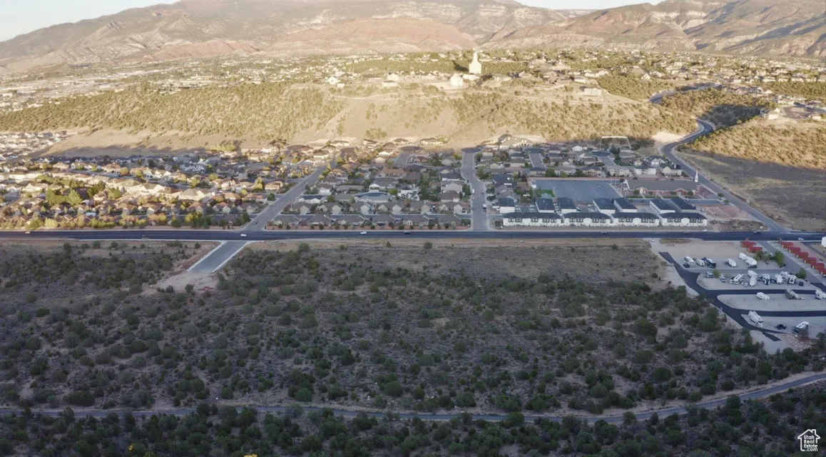 Aerial perspective of suburban area featuring a mountainous background