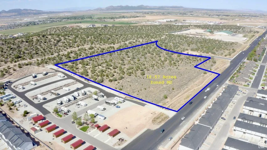 Aerial view of property's location featuring property boundaries highlighted and a mountainous background