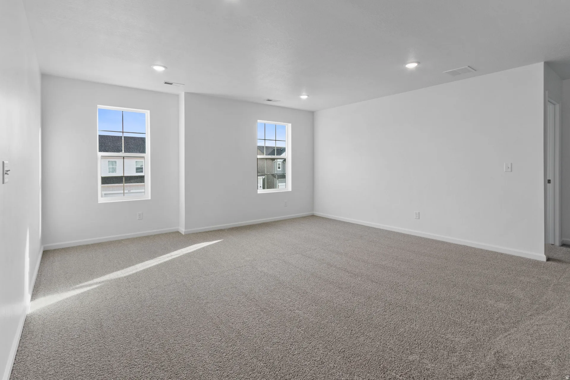 Upstairs loft with healthy amount of natural light and recessed lighting