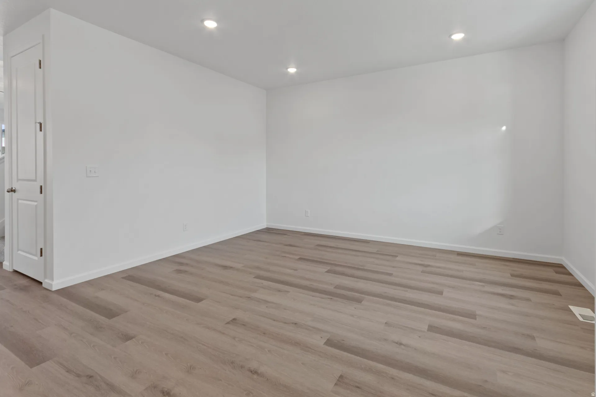 Front bonus room featuring recessed lighting and light wood finished floors