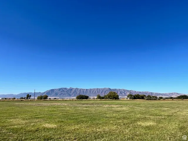 View of mountain backdrop with rural landscape