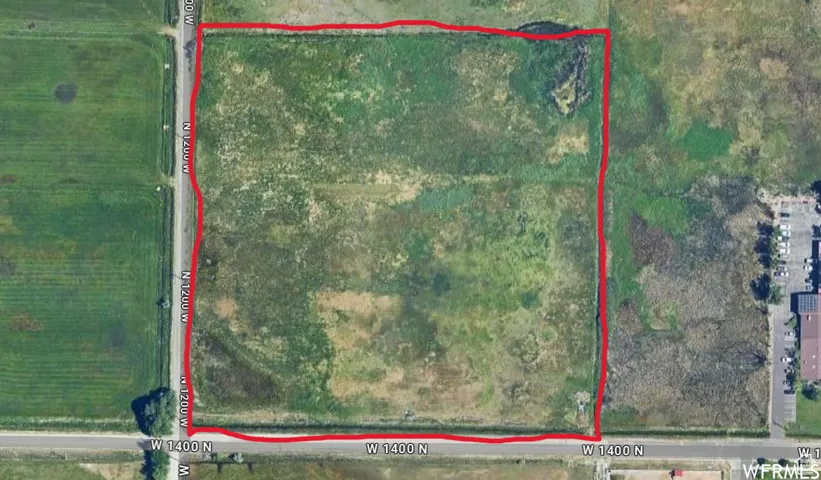 Aerial map of property and surrounding area featuring property boundaries highlighted