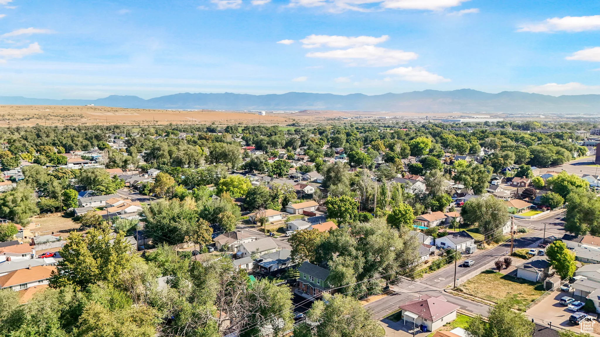 Aerial view of residential area with a mountainous background