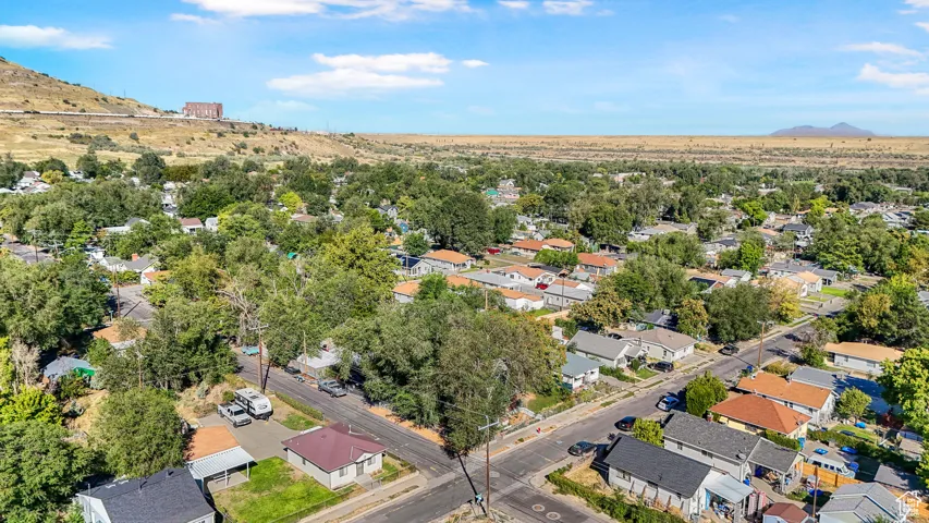 Aerial perspective of suburban area featuring a mountain backdrop
