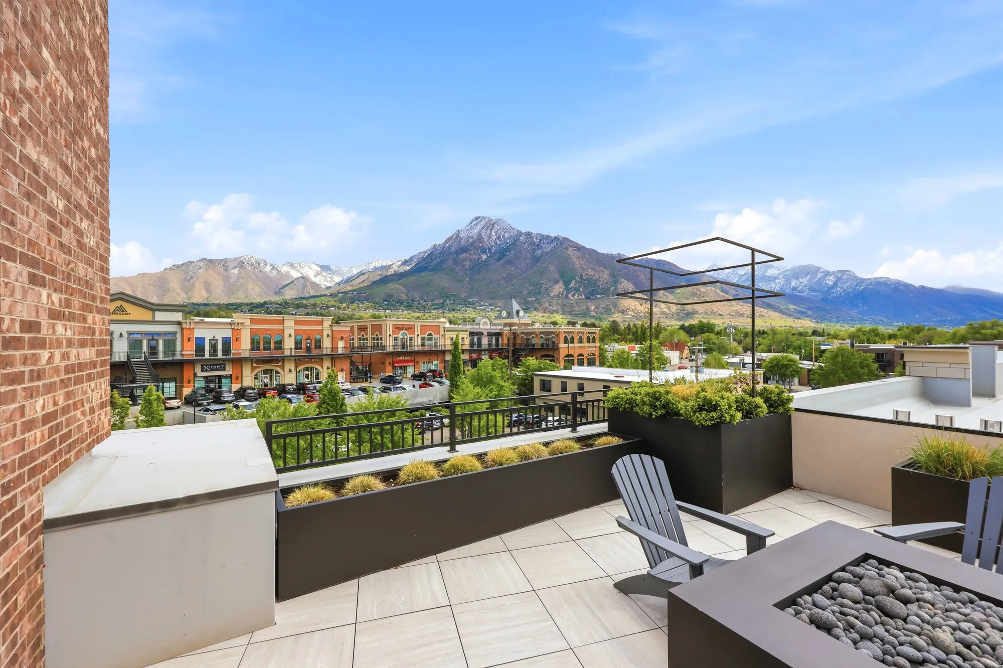 View of patio / terrace with a mountain view and a fire pit