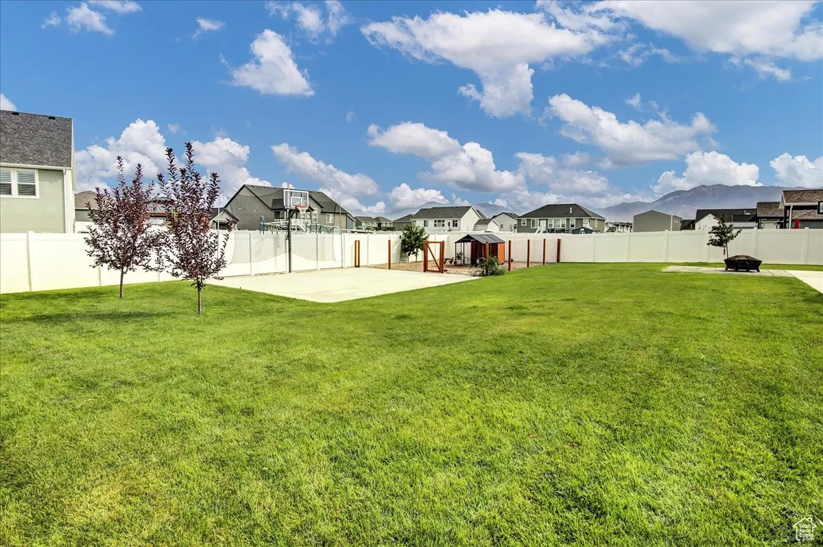 Fenced backyard with a residential view