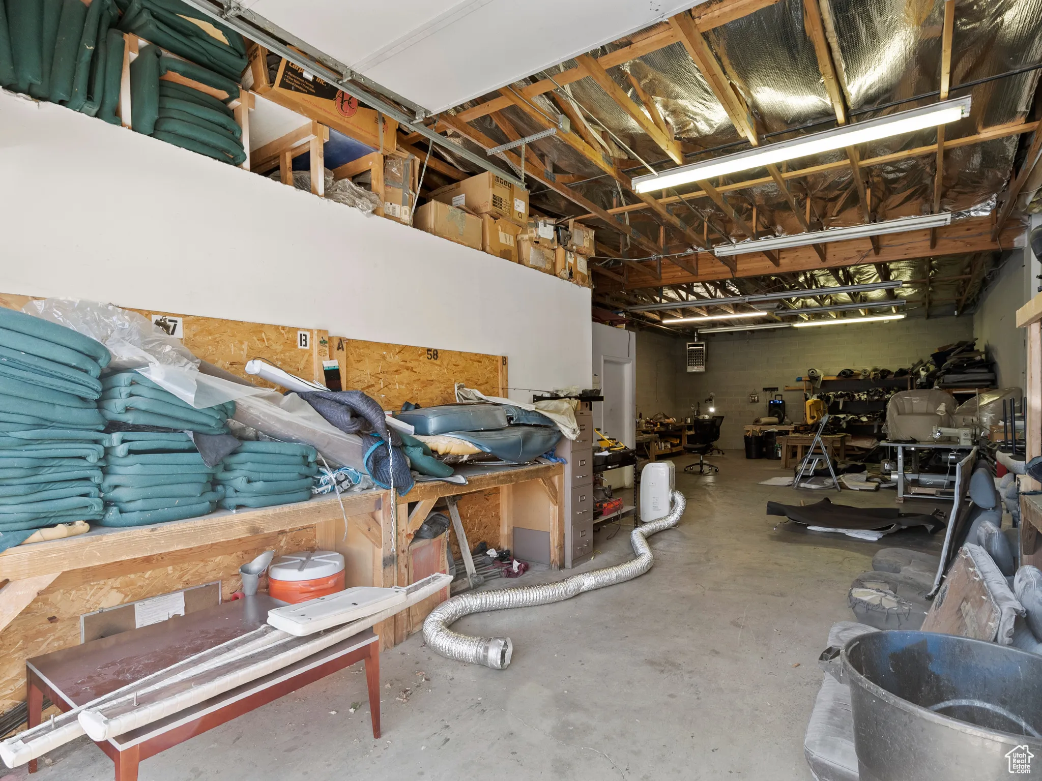 Garage featuring a workshop area