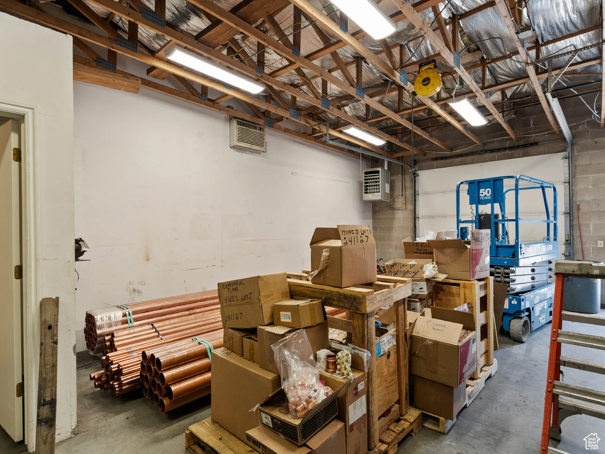Storage featuring a garage and a heating unit