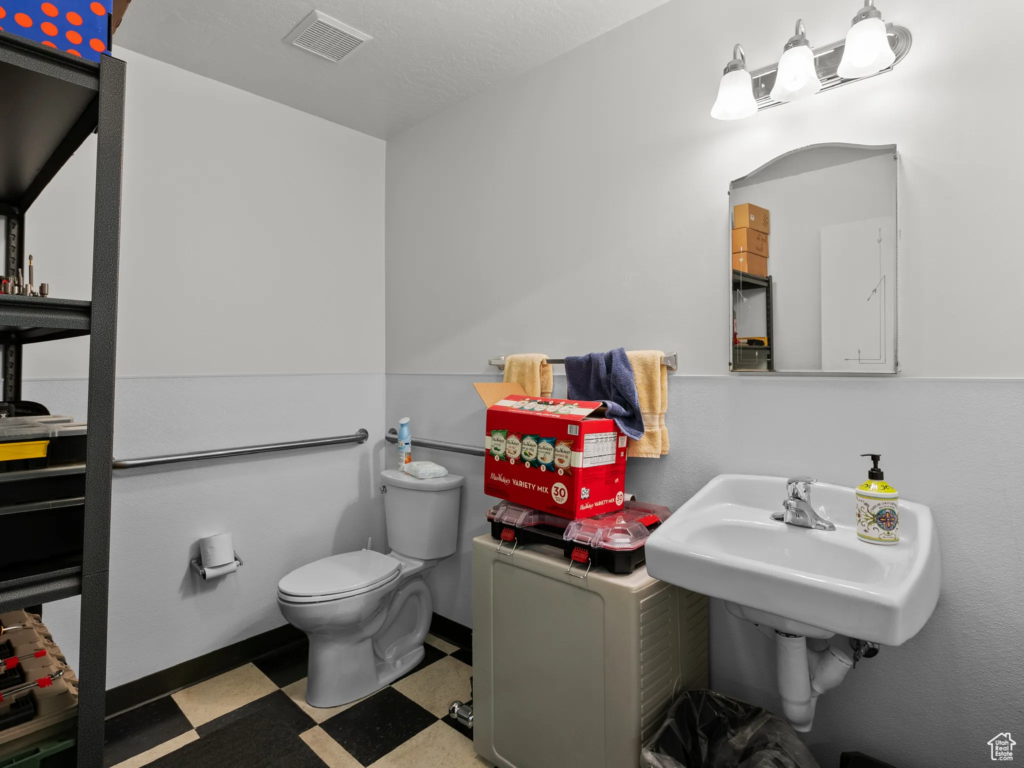 Bathroom with tile patterned floors and toilet