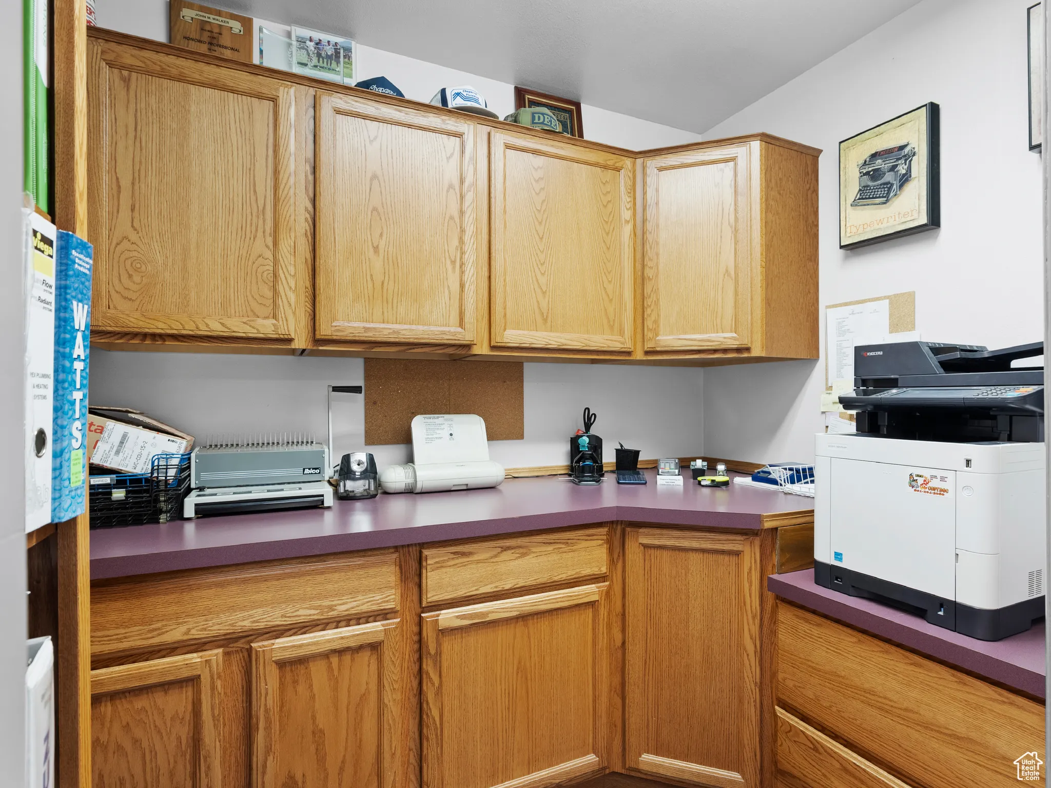 Kitchen featuring dark countertops and white microwave