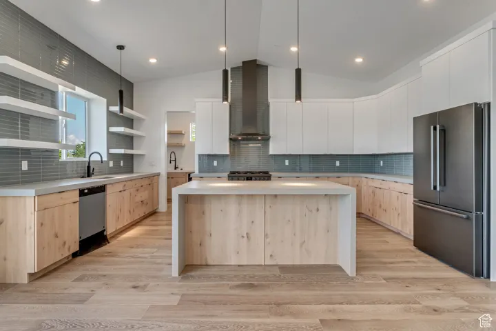 Kitchens feature a large central island, walk in pantry, pendant lighting, and a full appiance package.