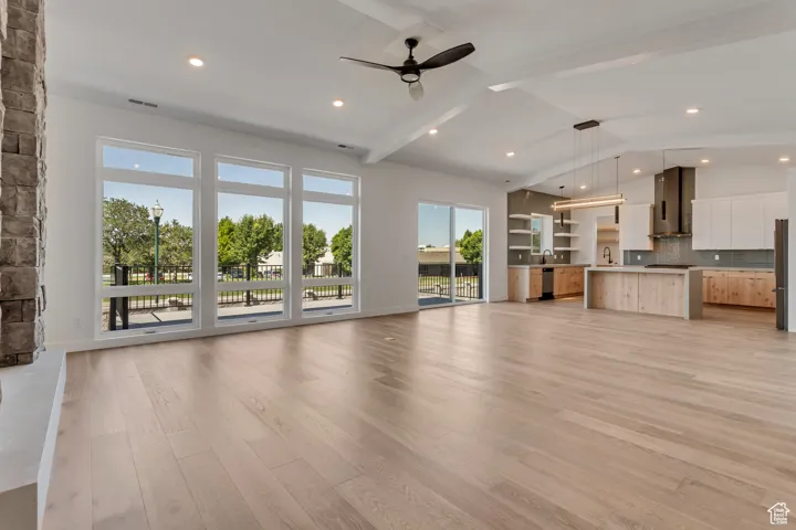 Open living rooms feature lots of natural light, a gas fireplace and vaulted ceilings.
