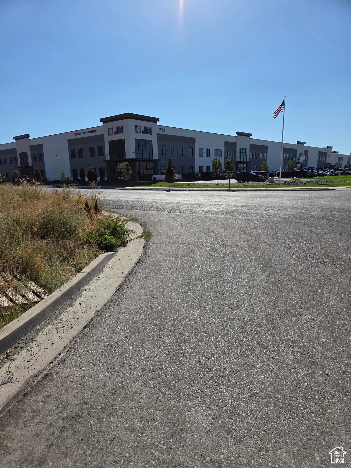 View of asphalt street with curbs