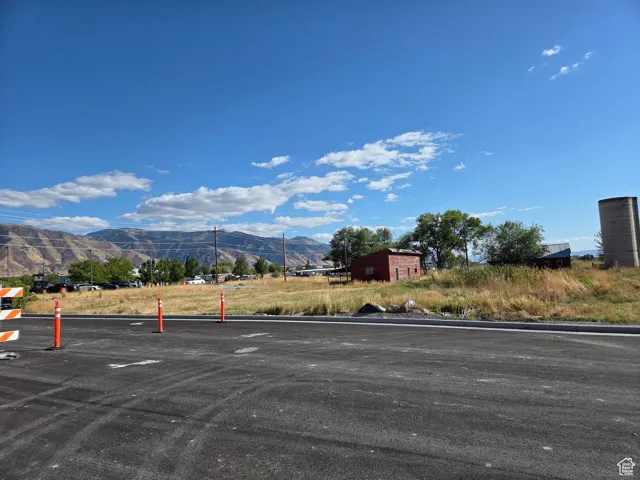 View of parking / parking lot with a mountain view