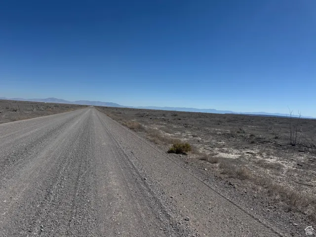 View of dirt / gravel road with a mountain view