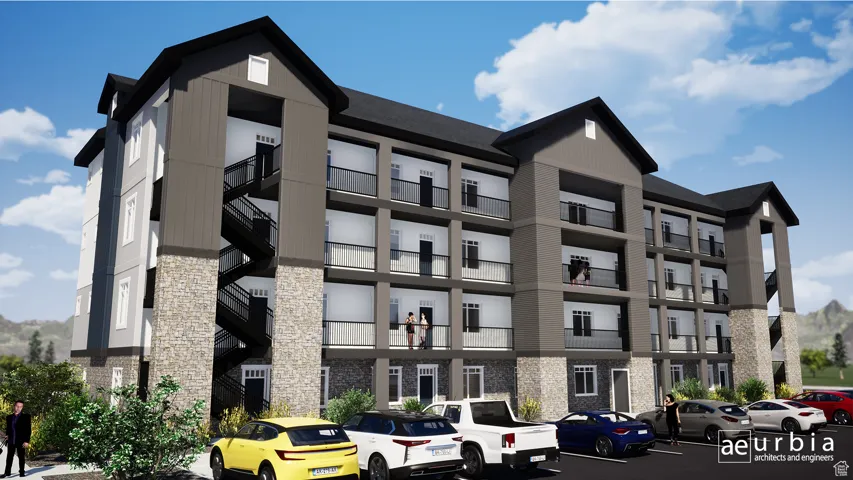 View of apartment building / complex with uncovered parking